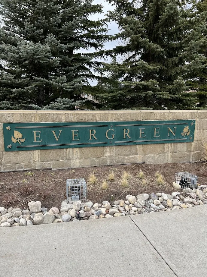 A community sign showing the name of Evergreen community within Calgary, Alberta, in the southwest side of Calgary.